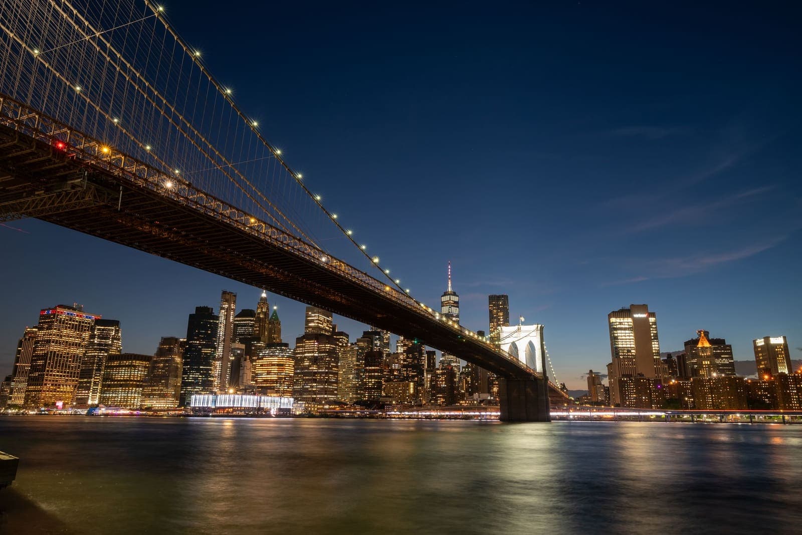 The Brooklyn Bridge and Lower Manhattan skyline lit up at night